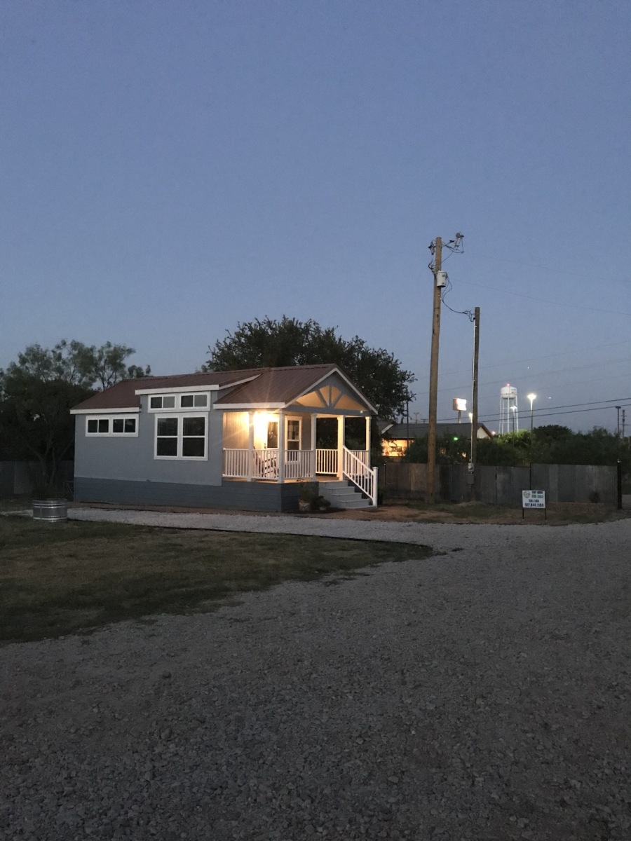 A Boxwood tiny home in the evening